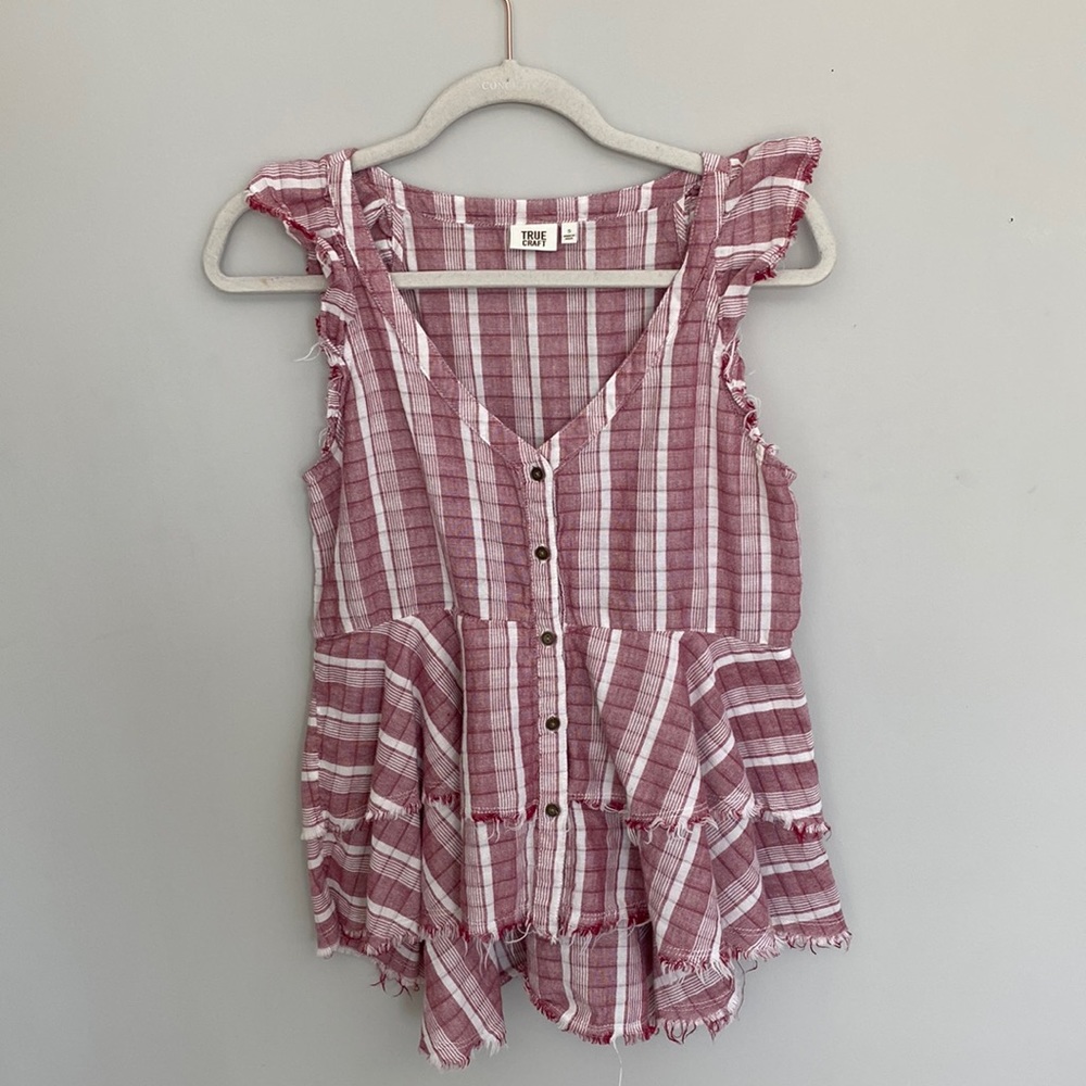 Pink and white flannel blouse. High to low design, size small.
